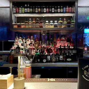 a bar with a variety of liquors