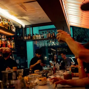 a bartender pouring a drink