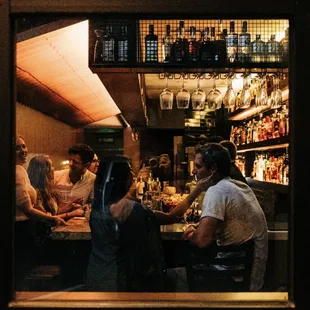 people sitting at a bar