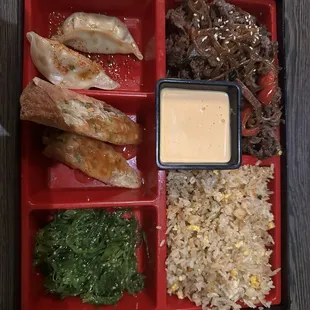 Bento box -bulgogi, fried rice, pan seared gyoza, egg rolls.