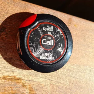 Very ingenious!  Each table on the patio has one for summoning your server.