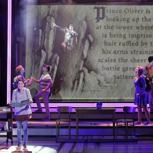 Arielle Jacobs as Delilah, and the cast of the world premiere musical BETWEEN THE LINES at KCRep. (Photo by Cory Weaver)