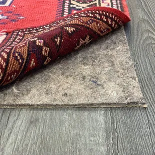 We sell premium-grade rug pad! We custom cut it to fit your rug