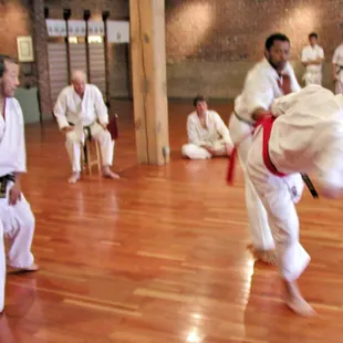 Sadaharu Honda referees a match between Ron Wafer and Bobby Bird. Caylor Adkins corner judges.