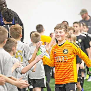 All smiles after the game from the referee to the goal keeper.