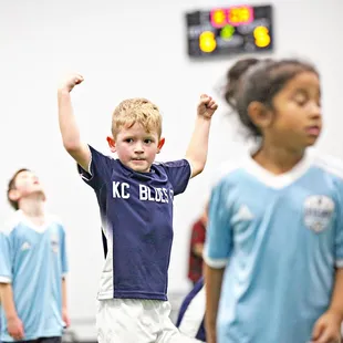 A young soccer player celebrates victory!