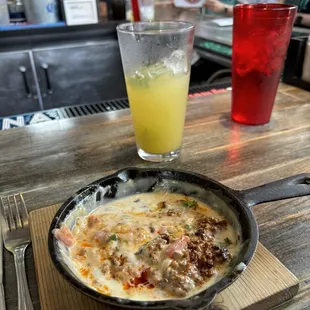 Cheese dip with chorizo and happy hour margaritas!