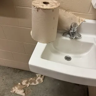 Terrible sinks with cold water only and broken paper towel holder
