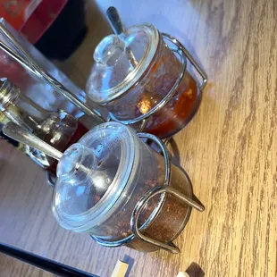 a close up of two jars of food