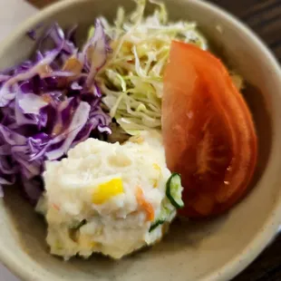 Potato salad with tomato and cabbage