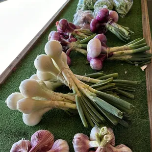 Garlic, yellow onion, white onion, purple onion, yams orange