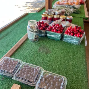 Blueberry, cherries, strawberry rhubarb jam, honey, strawberry jam.