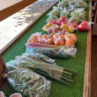 Thai chili, cilantro, green onion, parsley, dill, rhubarb, apricot, white peach, and tomatoes.