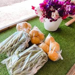 From left to right:  Fava beans, lemons, and sweet pea flowers.