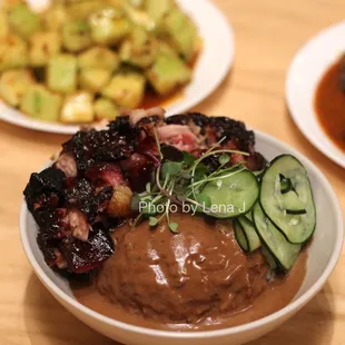 KAOKAO Char Siu Pork ($15.85) served w rice and pickled cucumbers. I preferred the chicken. The black bean sauce on the rice is pretty salty