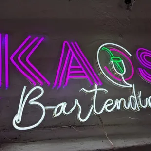 a neon sign for a bar