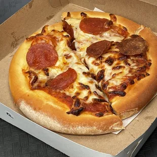 a pepperoni pizza in a box