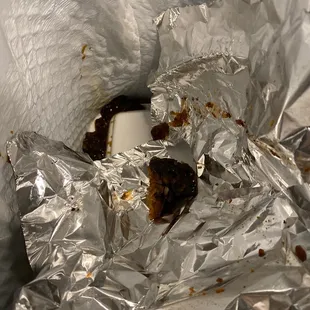 Beef and sauce in the trash