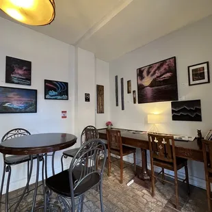 a dining room with a table and chairs