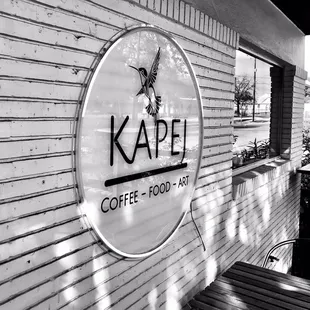 a black and white photo of a coffee shop
