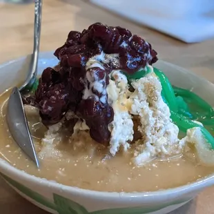 a bowl of soup with a spoon in it