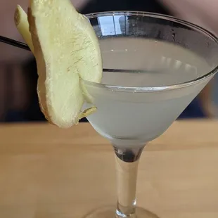 a close up of a drink in a martini glass