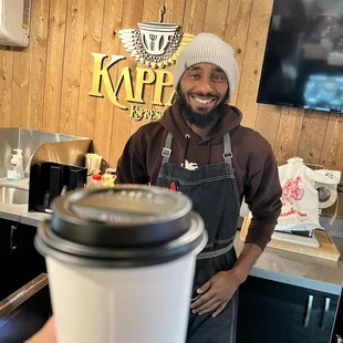 Owner and a triple shot latte