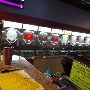 a row of soda dispensers