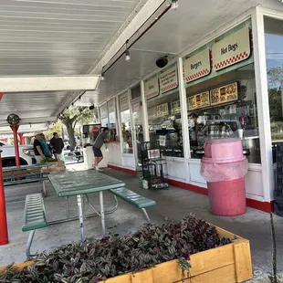 Order at window and sit outside or there are a few seats inside