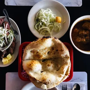 Beef Kabobs, Freshly baked naan bread, Chicken Karhahi.