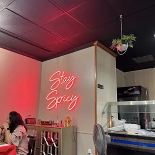 Neon Stay Spicy sign gives it that trending look!! However, pretty basic deco otherwise.