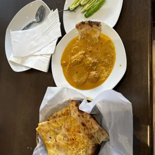 Chicken Korma With Garlic Cheese Naan .