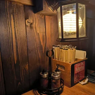 a wooden table with utensils on it