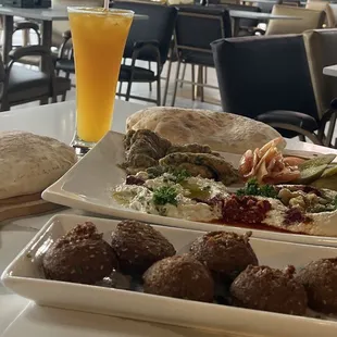 Arabic Breakfast - Falafel, Humus, Baba Ghanouj , eggs and vegies.