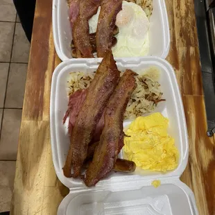 Karas Early riser breakfast eggs, hash browns, bacon, sausage and ham served with toast