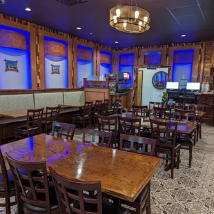 a dining area with tables and chairs