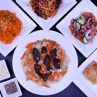 Our delicious Plov coupled with few appetizers and salads: Markovcha, Korean Eggplant, Samarkand Salad, and Somsa.