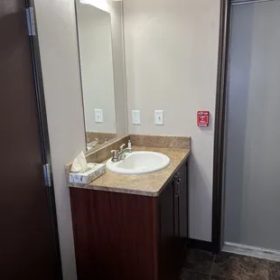 The sink is in the room so a person can be using the loo and the other person using the sink at the same time.