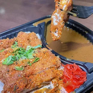 Chicken katsu dunked in Japanese curry
