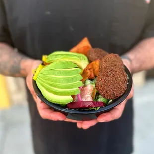 a man holding a plate of food