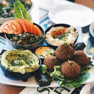 PLANTBASEDFATKID modified with cilantro lime hummus. 100% VEGAN Pita and sauce included!