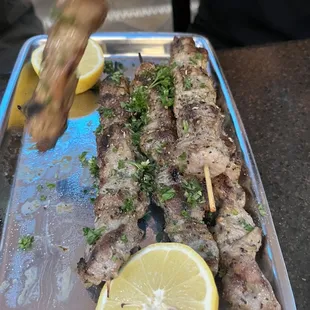 Pork souvlaki. They were so good they couldn&apos;t stay on the plate, literally