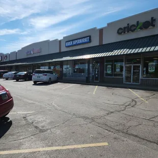 parking lot with cars parked in front
