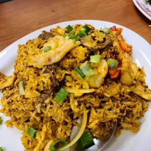 Curry fried rice. 8/10 in flavor but a little dry! Overall worth it!