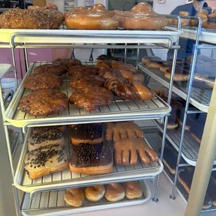 a variety of donuts in a display case