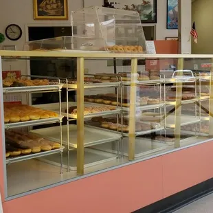 a display case with a variety of donuts