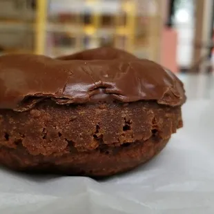 a chocolate donut with chocolate frosting