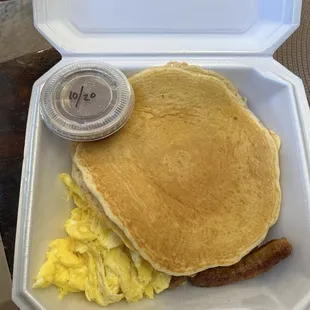 Two pancakes, two eggs and meat