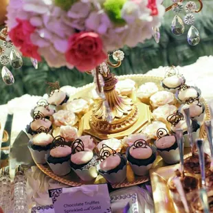 Mini Kalhua Chocolate Cupcakes with Coffee Cream surrounding the base of the tiered cupcake stand. Cupcake wrappers included.