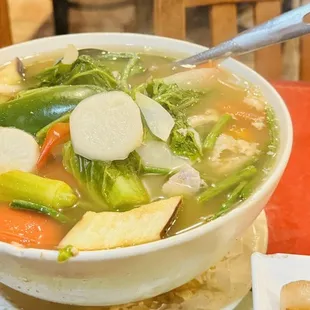 a bowl of soup and a plate of food